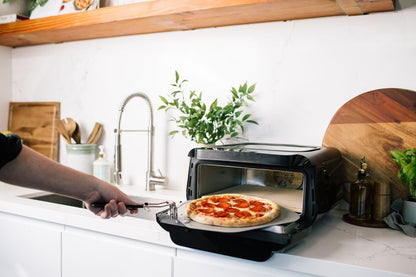Frigidaire 700°F Indoor Electric Pizza Oven – 12” Stone Bake, Air Fry & Bake, Portable Countertop with Peel & Cutter